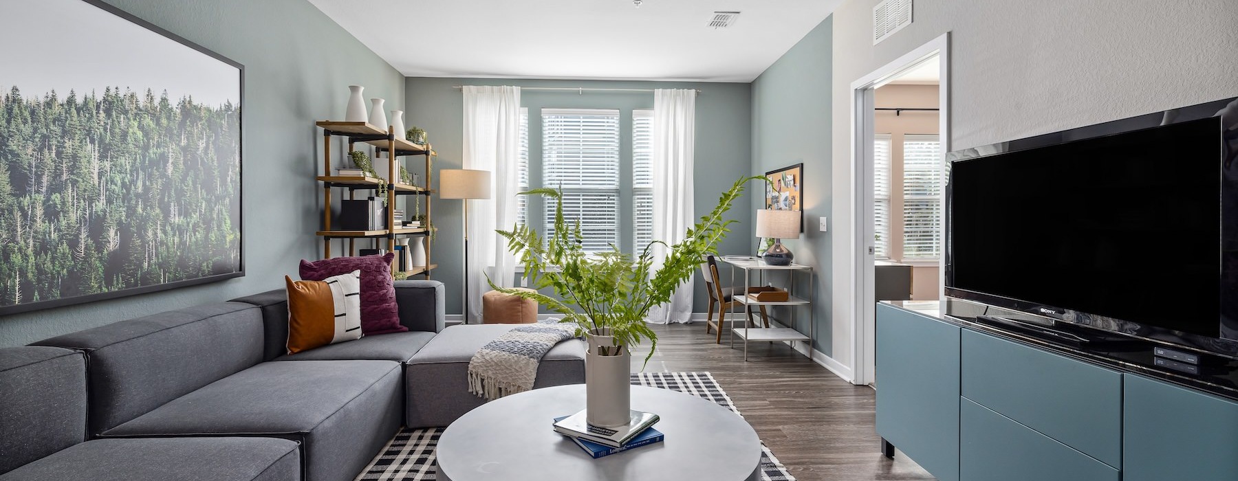 a living room with a couch and a tv
